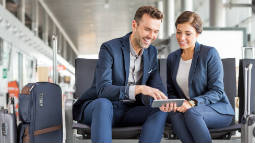 business travelers looking at tablet