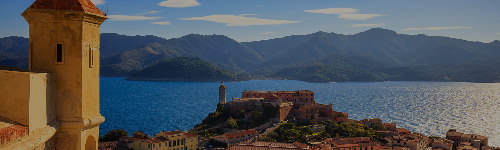 mediterranean landscape on the water with hills in the background