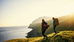 couple hiking by ocean