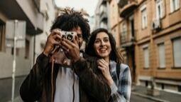 young couple with camera