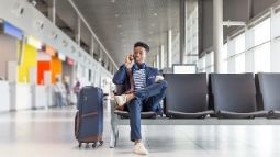 young man waiting for flight