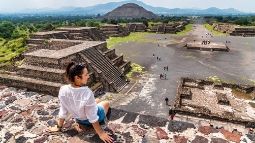 young female visits ancient Teotihuacan pyramids in Mexico City